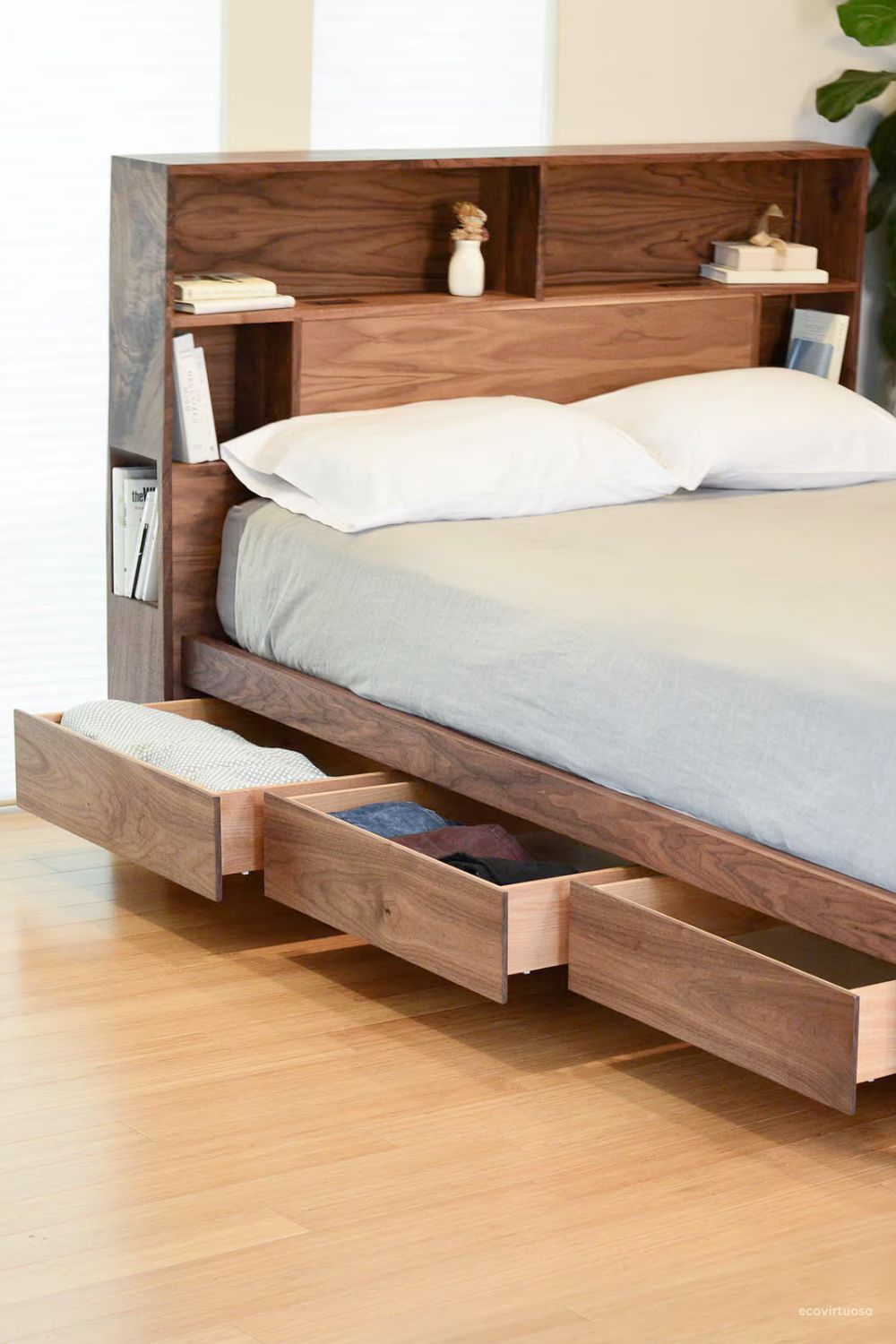 a bed with headboard and storage