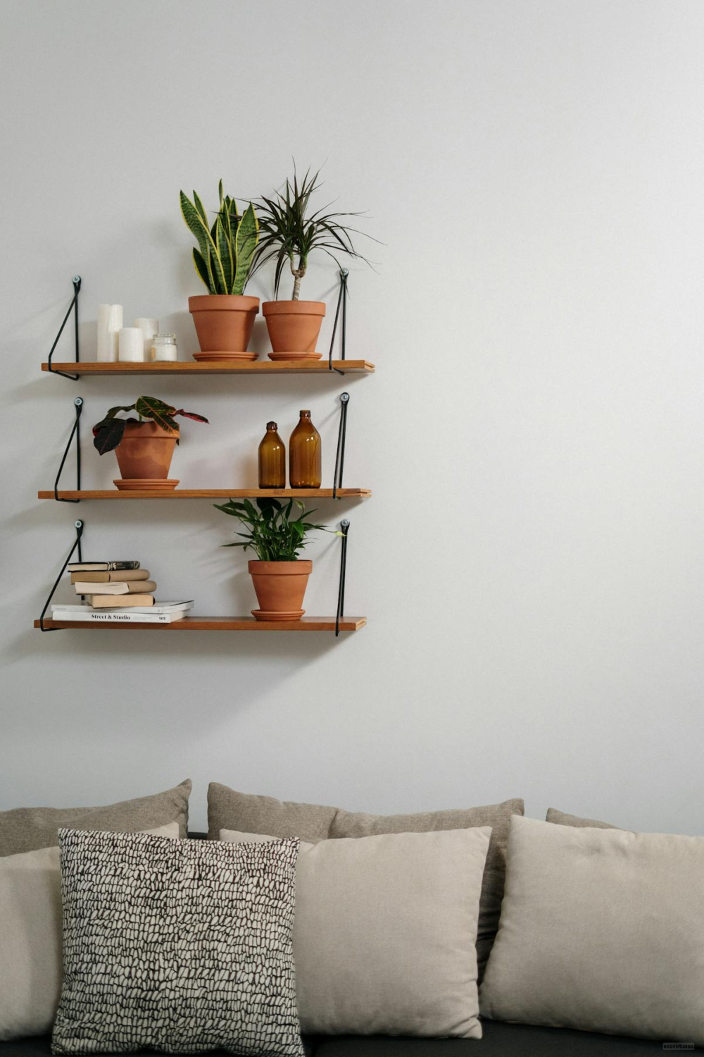 a bedroom with wall mounted shelves